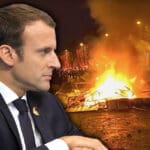 Macron i zapaljeni Pariz